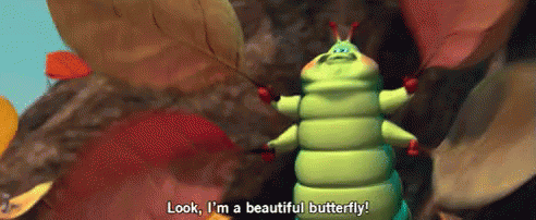 GIF of a caterpillar holding up leaves and saying "Look, I'm a beautiful butterfly!"